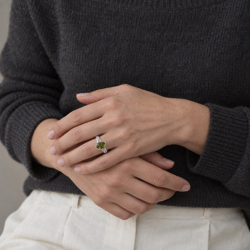 On the Second Beat — green peridot ring, AI-assisted editorial wearing view [asset:c52714602ba3]