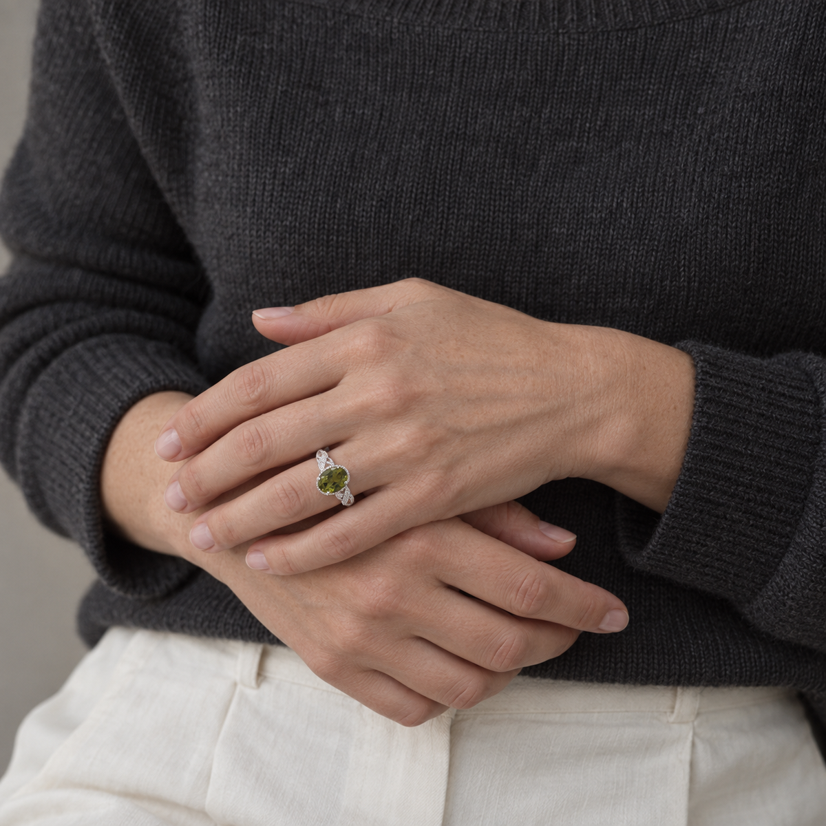 On the Second Beat — green peridot ring, AI-assisted editorial wearing view [asset:c52714602ba3]