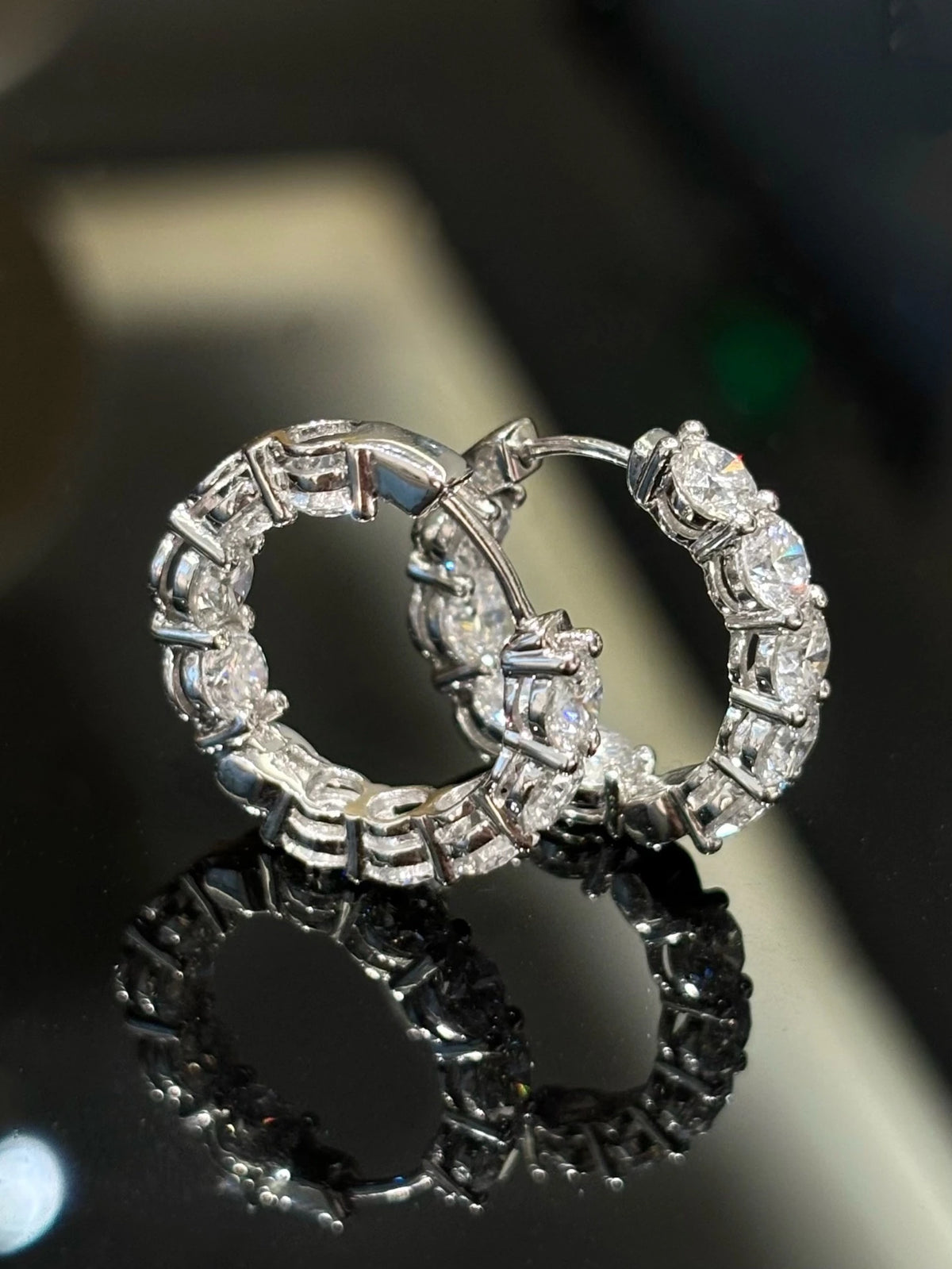 Round diamond hoop earrings in 18K white gold, detail view 1