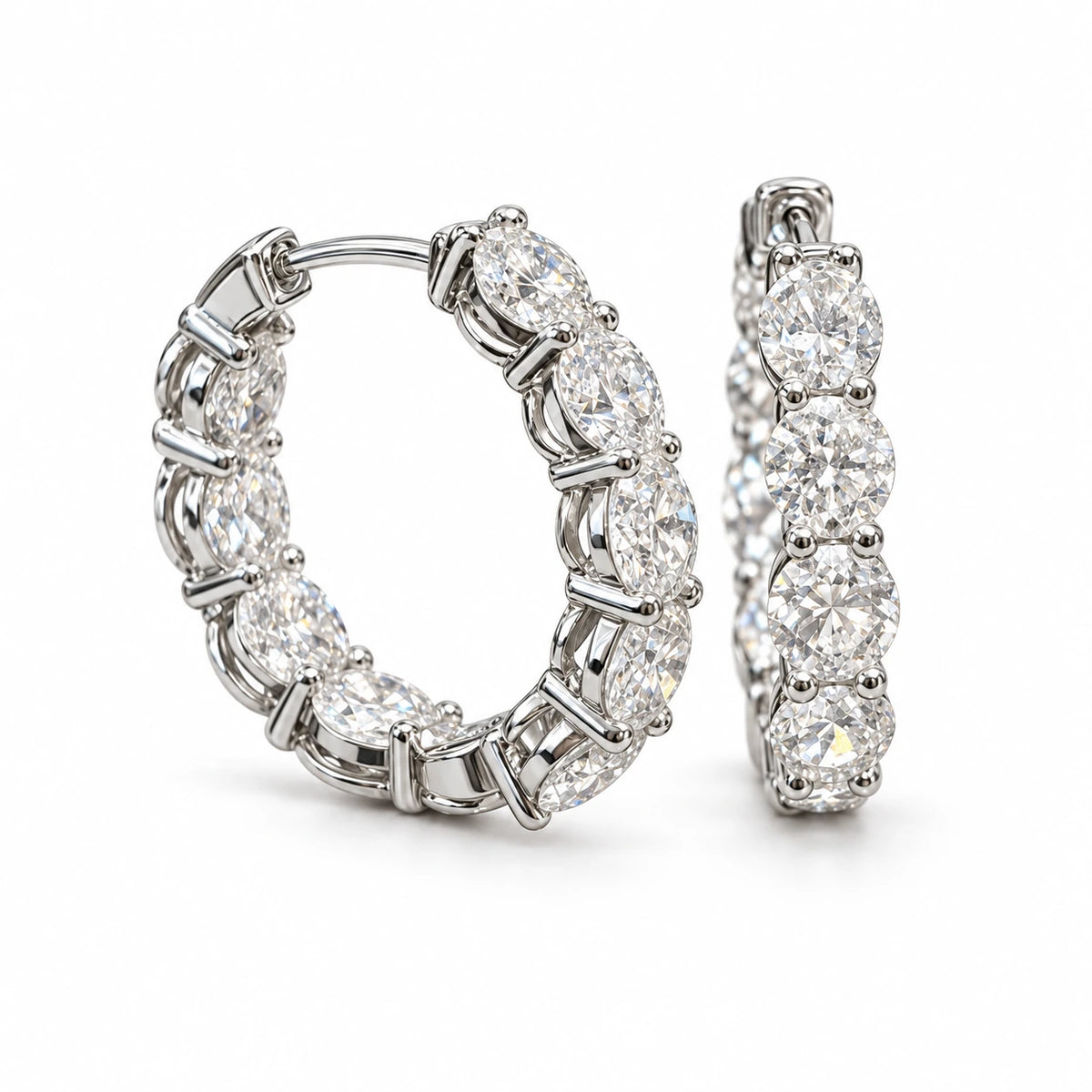Pair of round lab-grown diamond hoop earrings in 18K white gold on white background