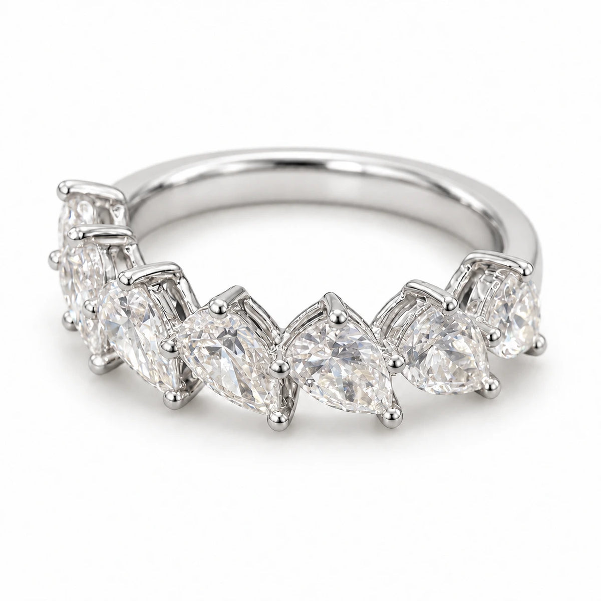 Seven pear-cut lab-grown diamonds set in an 18K white gold band on white background