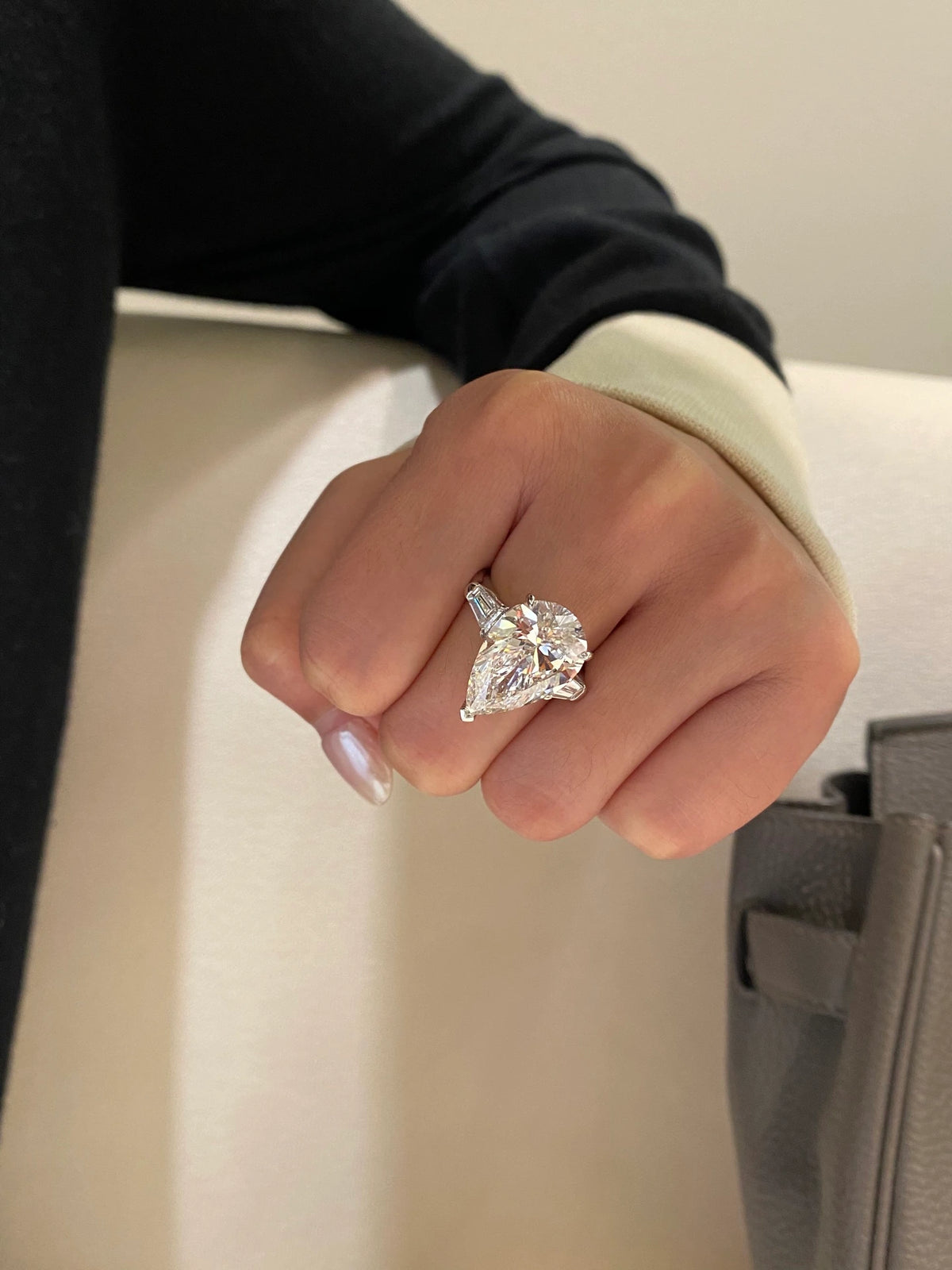 Pear-cut diamond ring with tapered baguette side stones in 18K white gold, original view 5