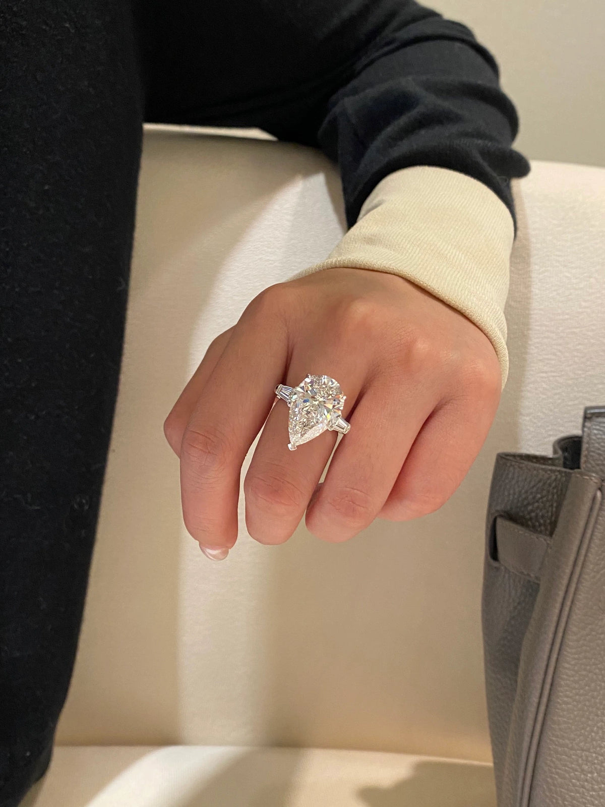 Pear-cut diamond ring with tapered baguette side stones in 18K white gold, original view 6