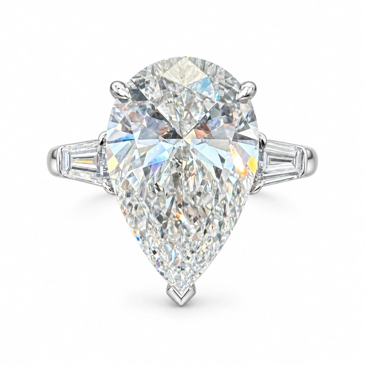 Pear-cut diamond ring with two tapered baguette side stones in 18K white gold on white background