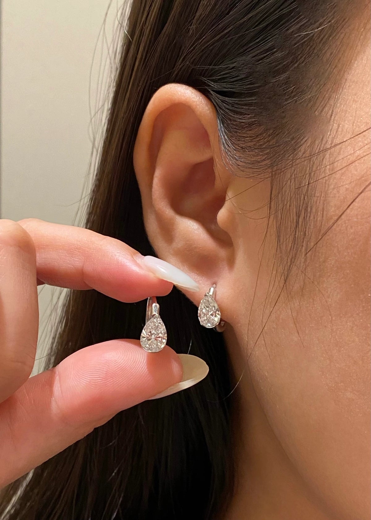 Pear-cut diamond earrings in 18K white gold, original wearing view 9