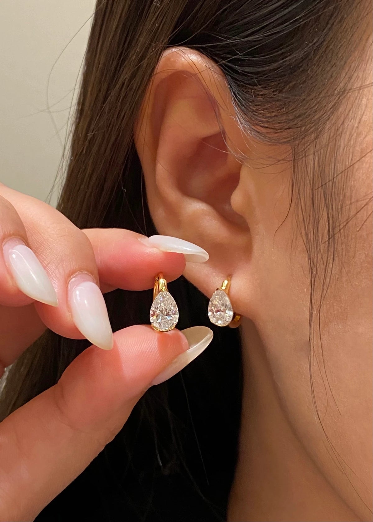 Pear-cut diamond earrings in 18K yellow gold, original wearing view 6