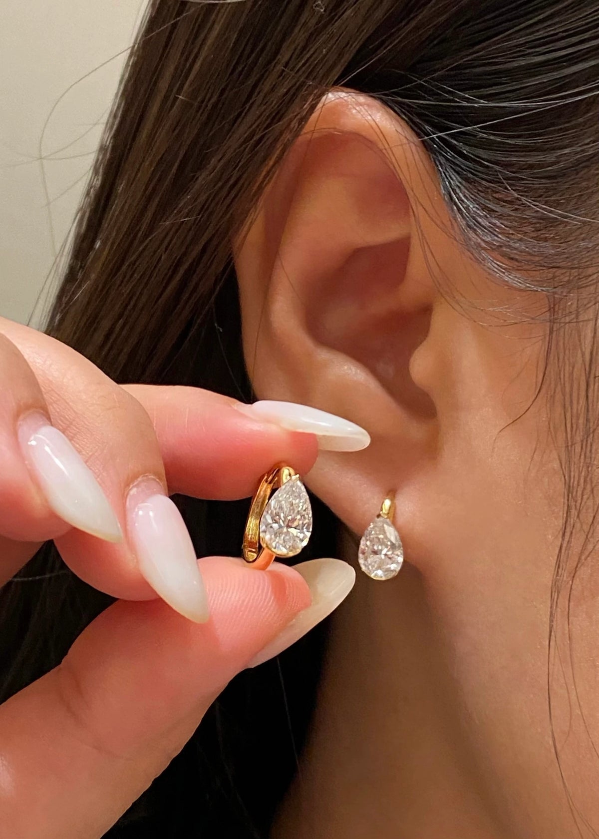 Pear-cut diamond earrings in 18K yellow gold, original wearing view 7
