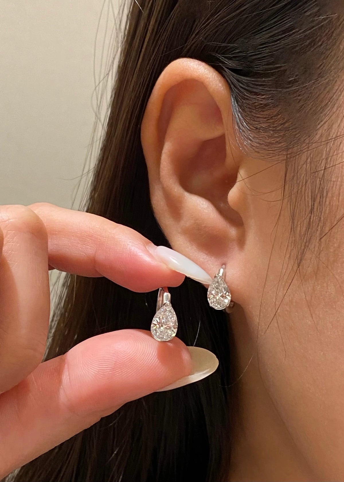 Pear-cut diamond earrings in 18K white gold, original wearing view 8