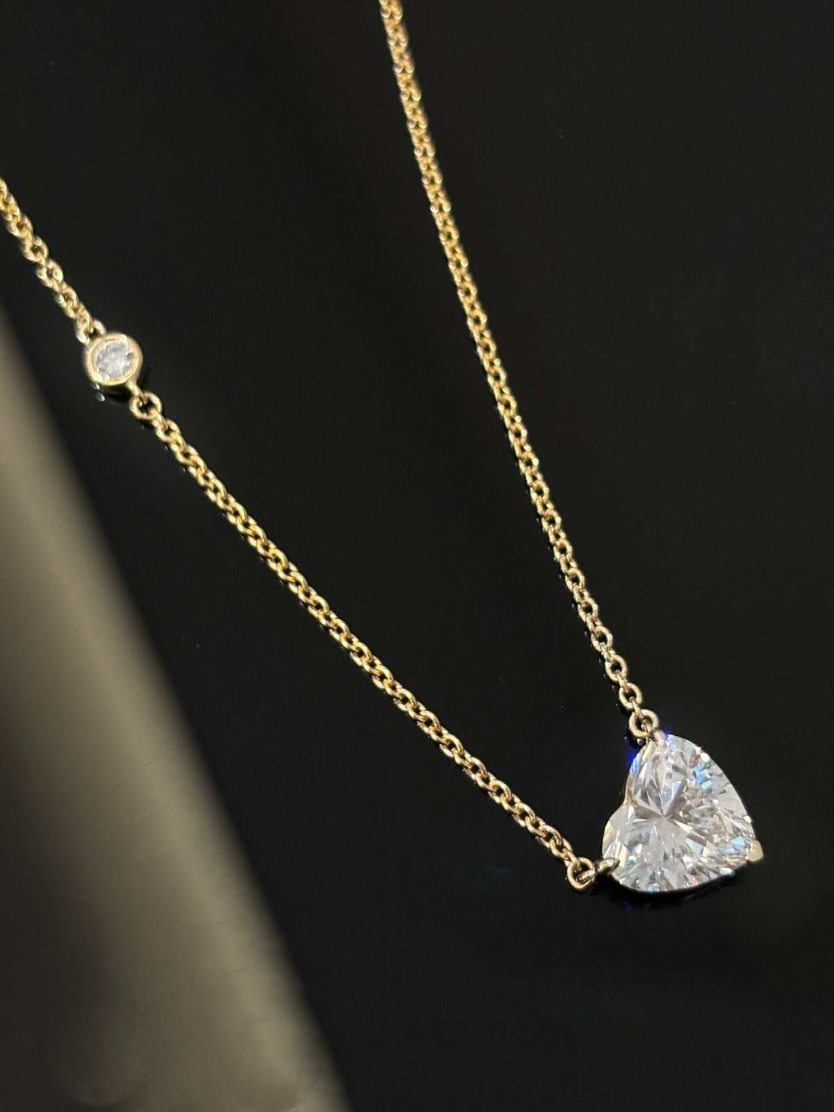 Heart-cut lab-grown diamond necklace with a round diamond accent, original detail view 3