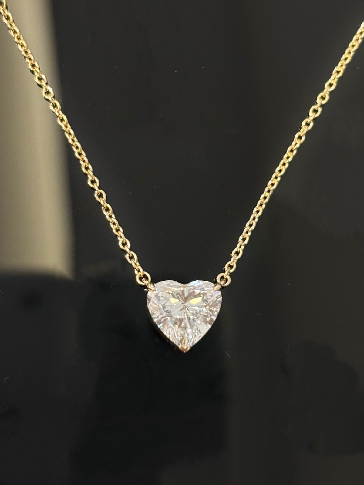 Heart-cut lab-grown diamond necklace with a round diamond accent, original detail view 4