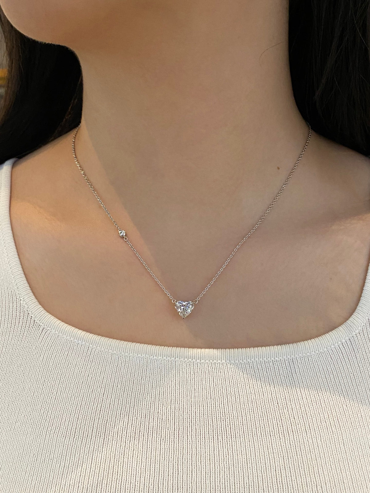 Heart-cut lab-grown diamond necklace with a round diamond accent, original wearing view 1