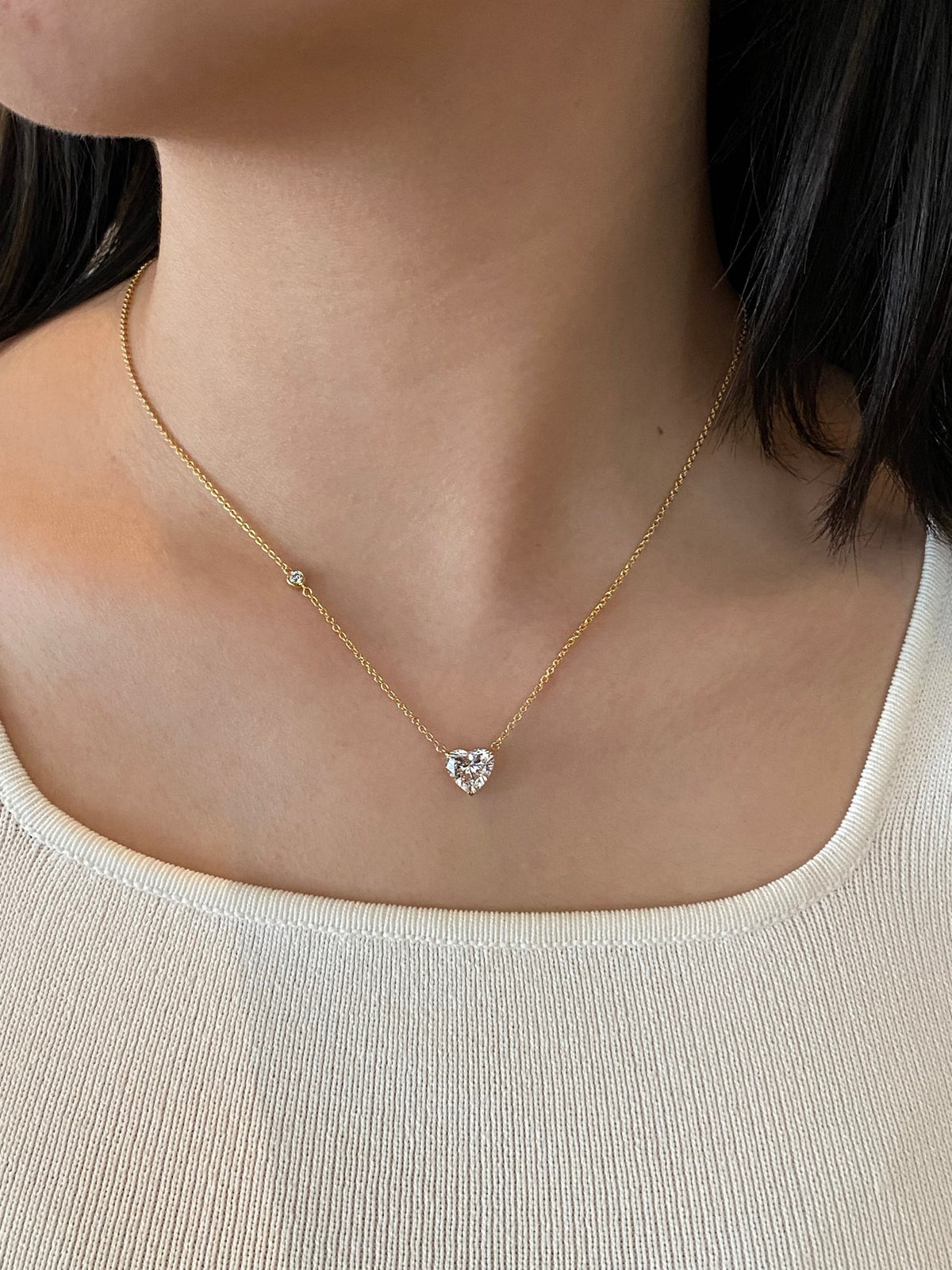 Heart-cut lab-grown diamond necklace with a round diamond accent, original wearing view 3