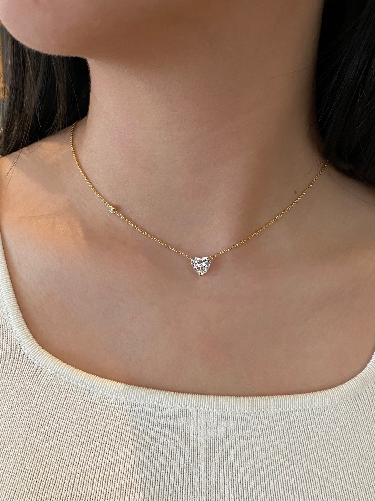 Heart-cut lab-grown diamond necklace with a round diamond accent, original wearing view 4