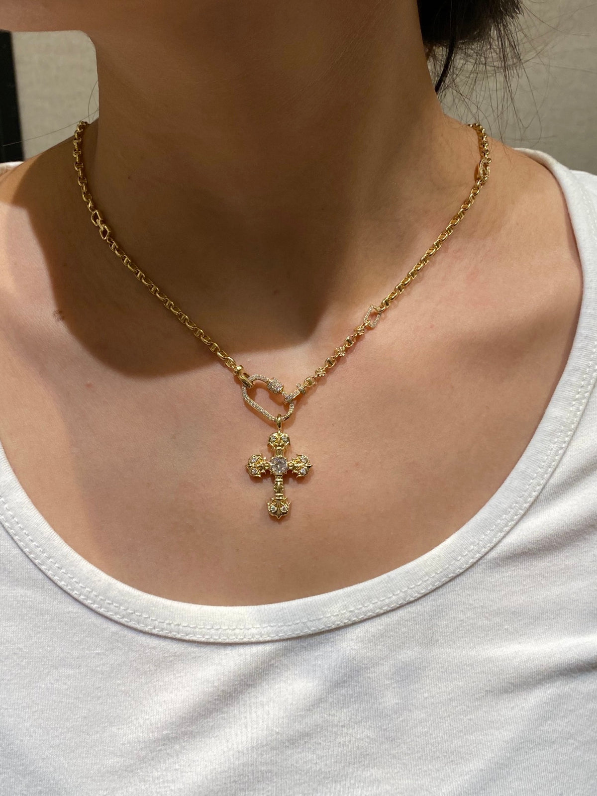 Flame cross lab-grown diamond pendant in yellow gold, original wearing view; chain not included