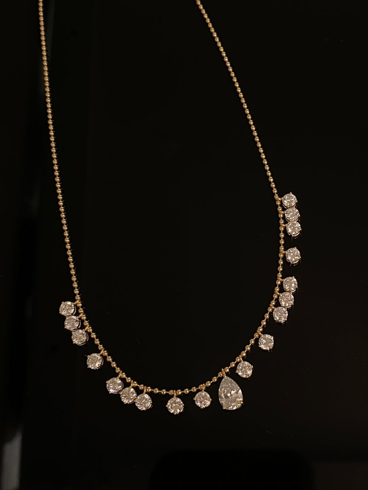 Pear and round lab-grown diamond necklace on a yellow-gold bead chain, original front view