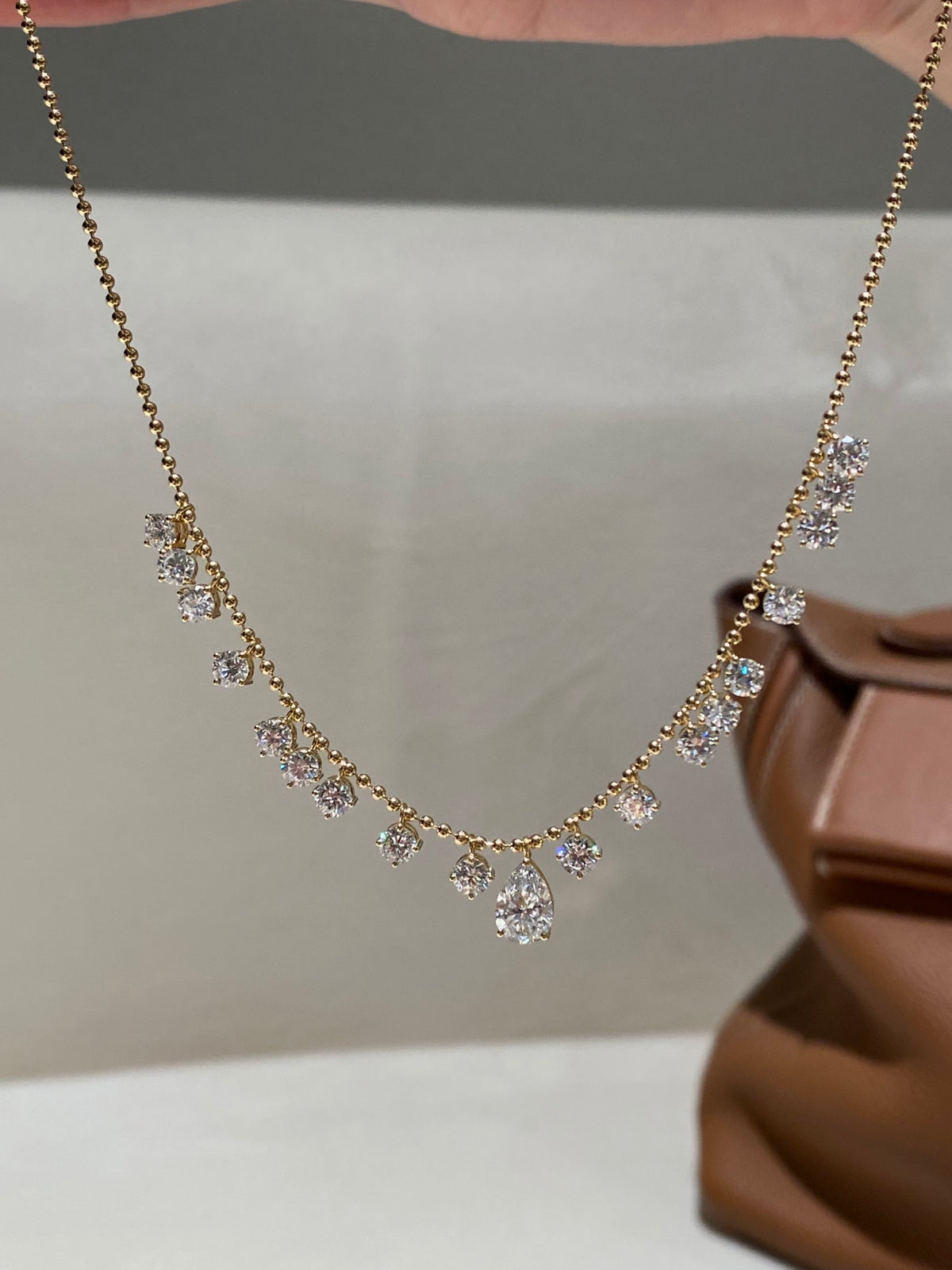 Pear and round lab-grown diamond bead-chain necklace, original handheld view
