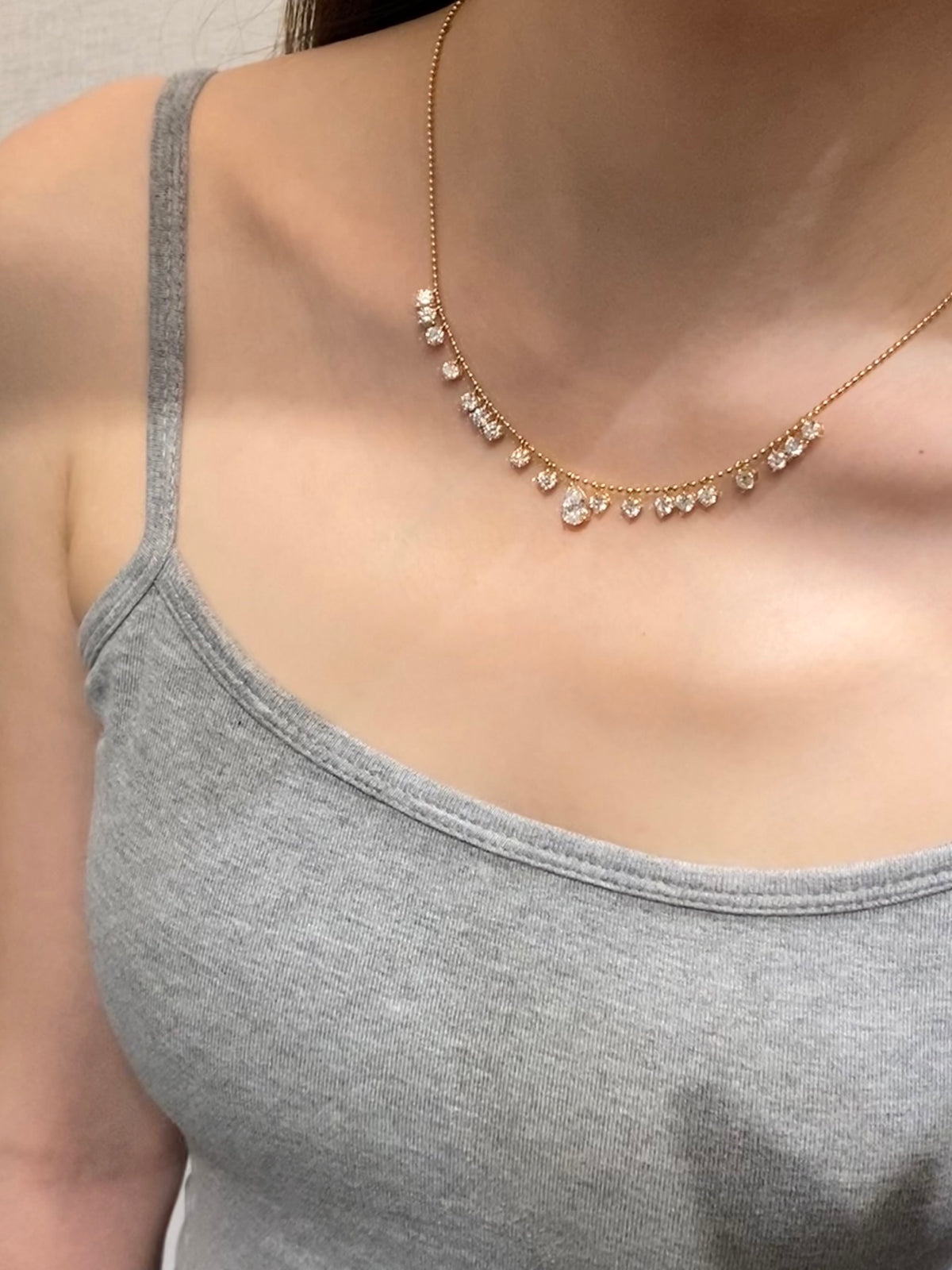 Pear and round lab-grown diamond bead-chain necklace, original wearing view 1
