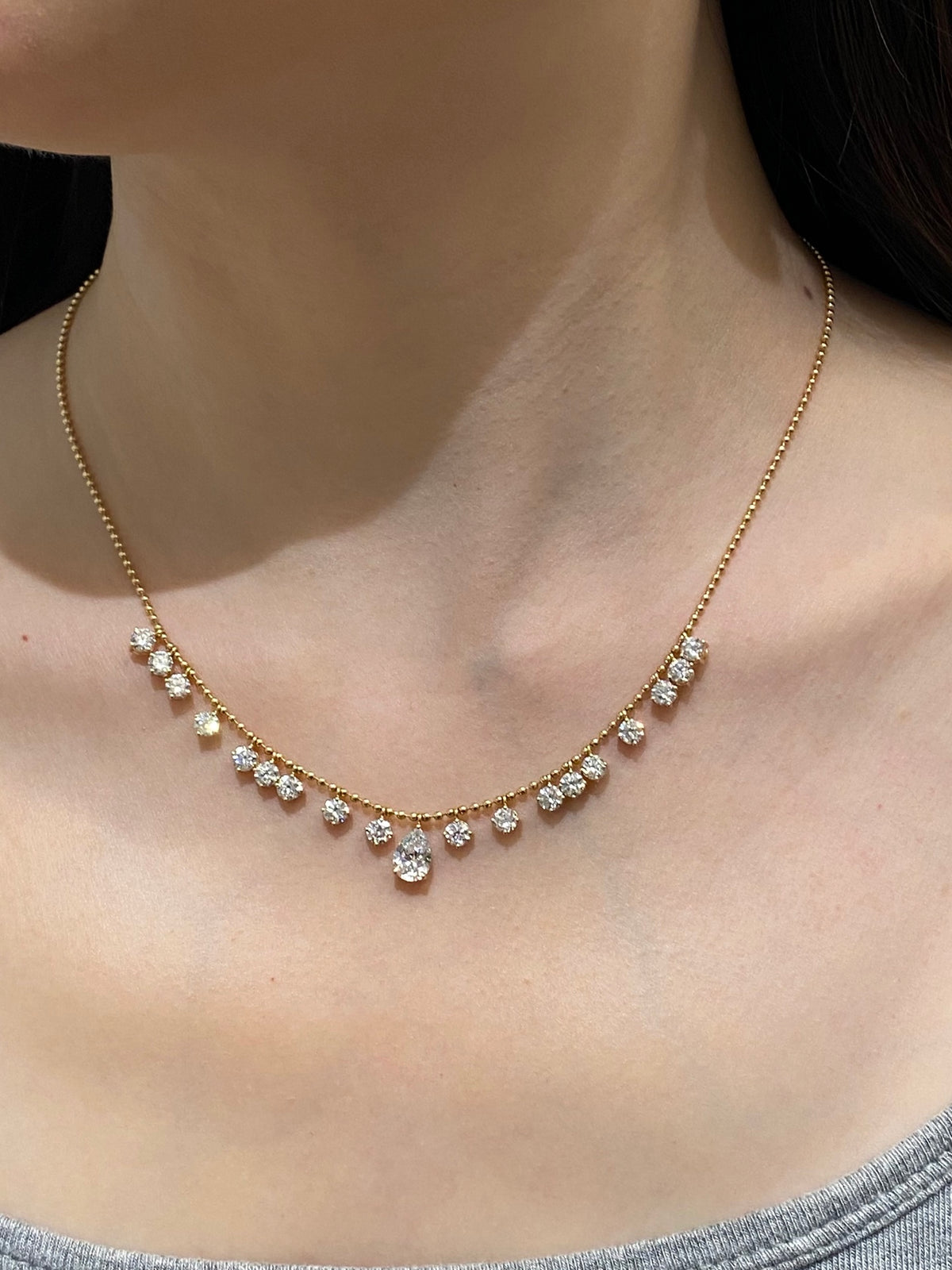 Pear and round lab-grown diamond bead-chain necklace, original wearing view 2