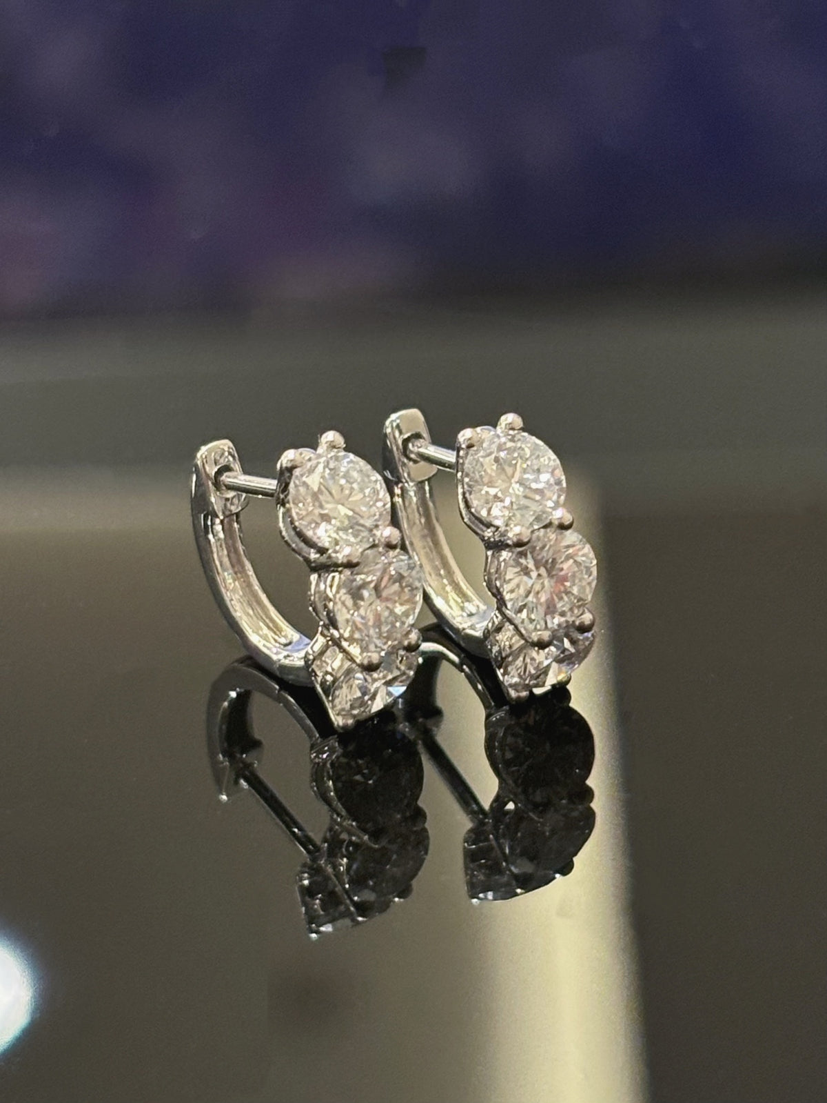 Three-round-diamond hoop earrings in white metal, original pair front view