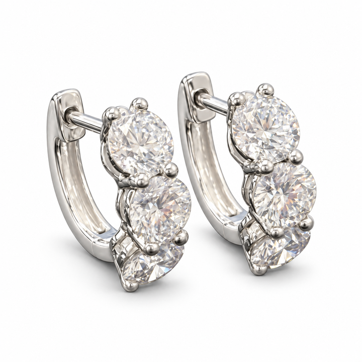 Three-round lab-grown diamond hoop earrings in 18K white gold, pair on white background