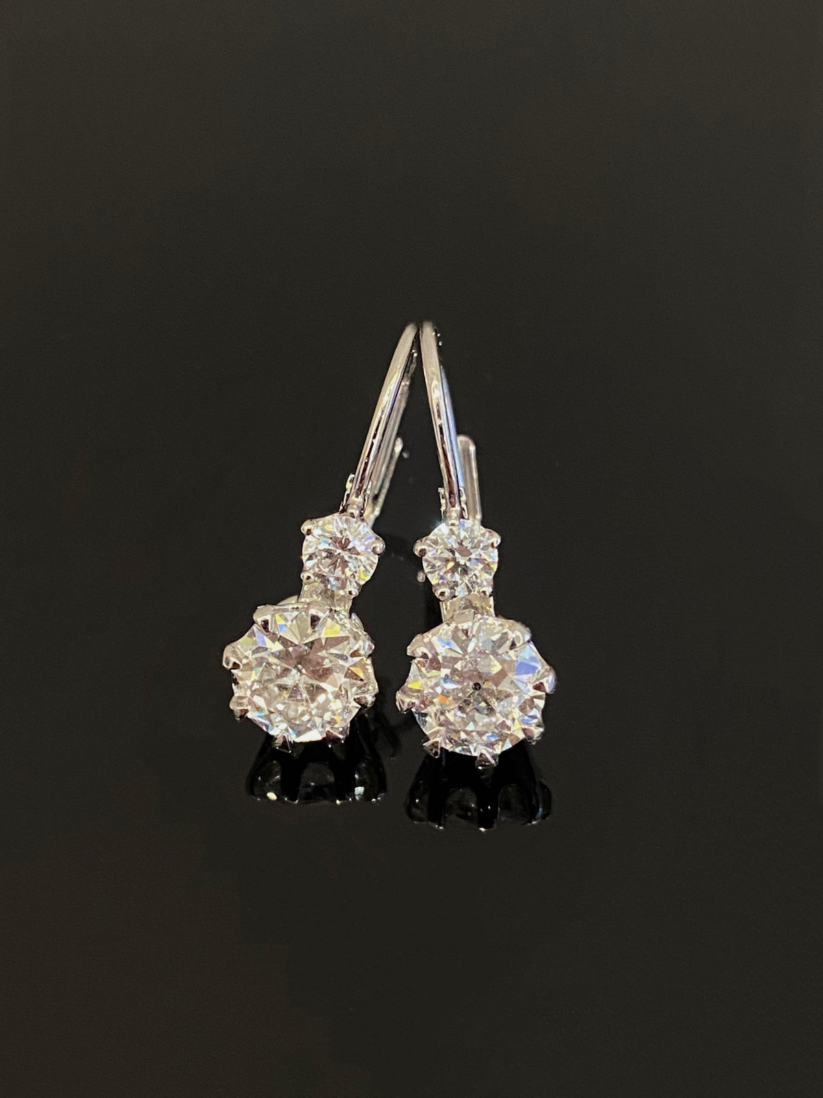 Old European-cut diamond drop earrings in white metal without outer halos, original pair
