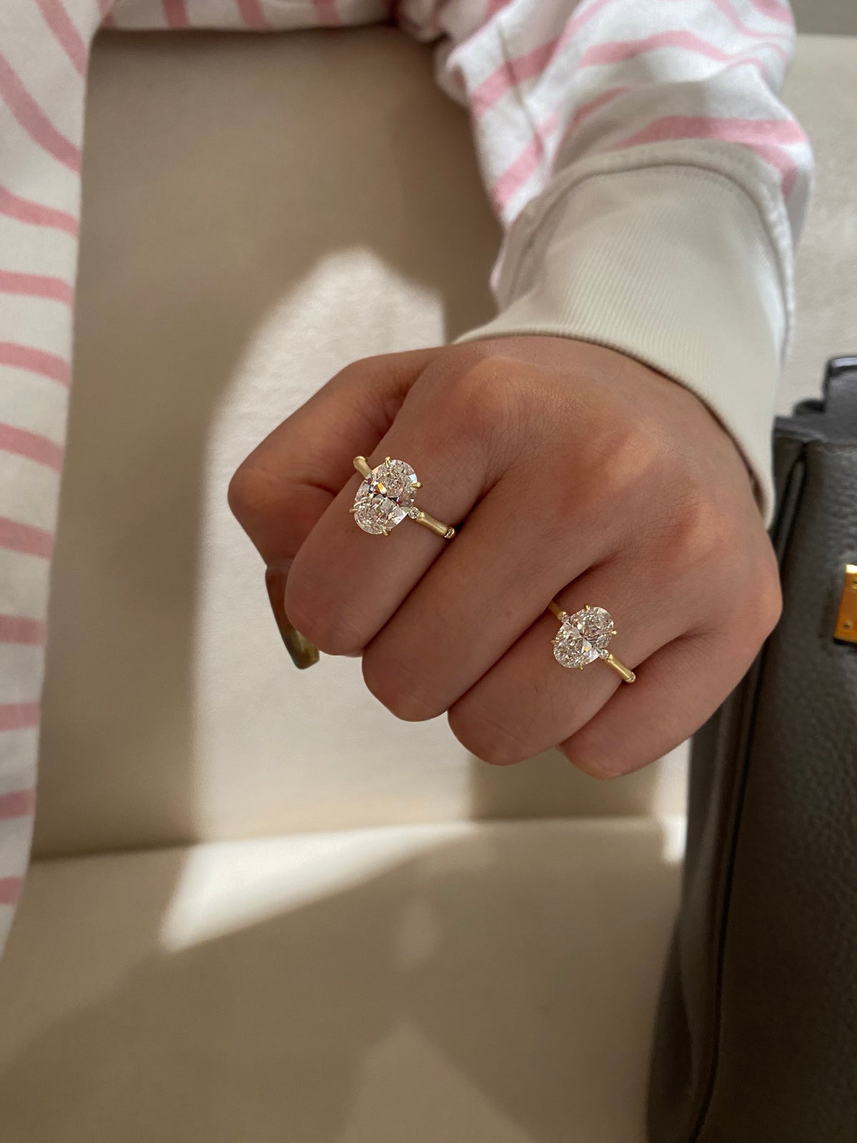 Two oval diamond bamboo-band rings, original wearing comparison