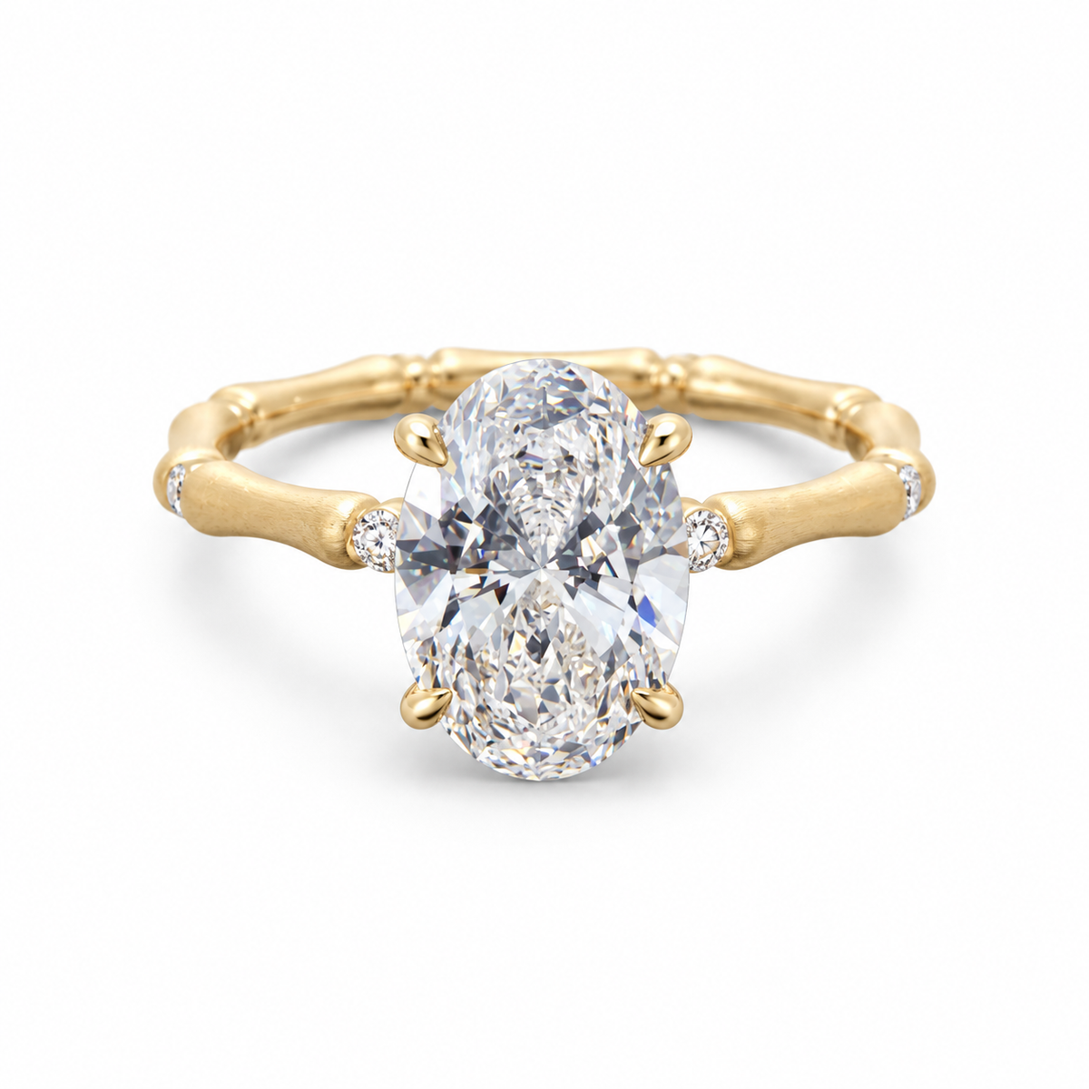 Oval lab-grown diamond bamboo-band ring in 18K yellow gold, frontal design view on white background