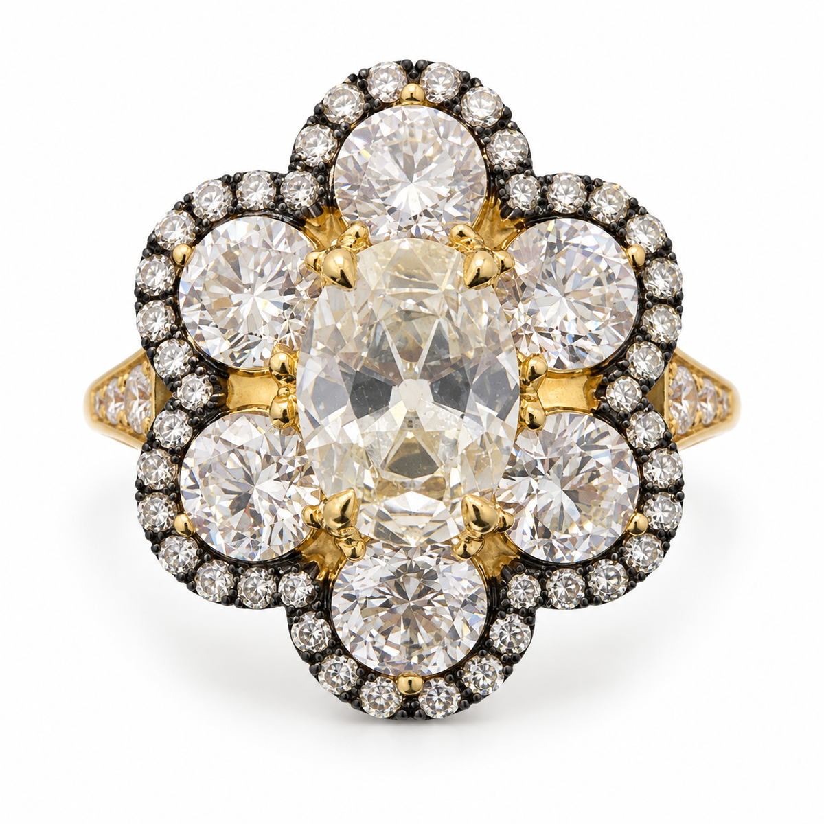 Antique-cut floral lab-grown diamond ring in 18K yellow gold with six round diamond petals, dark halo details and diamond-set shoulders on white background