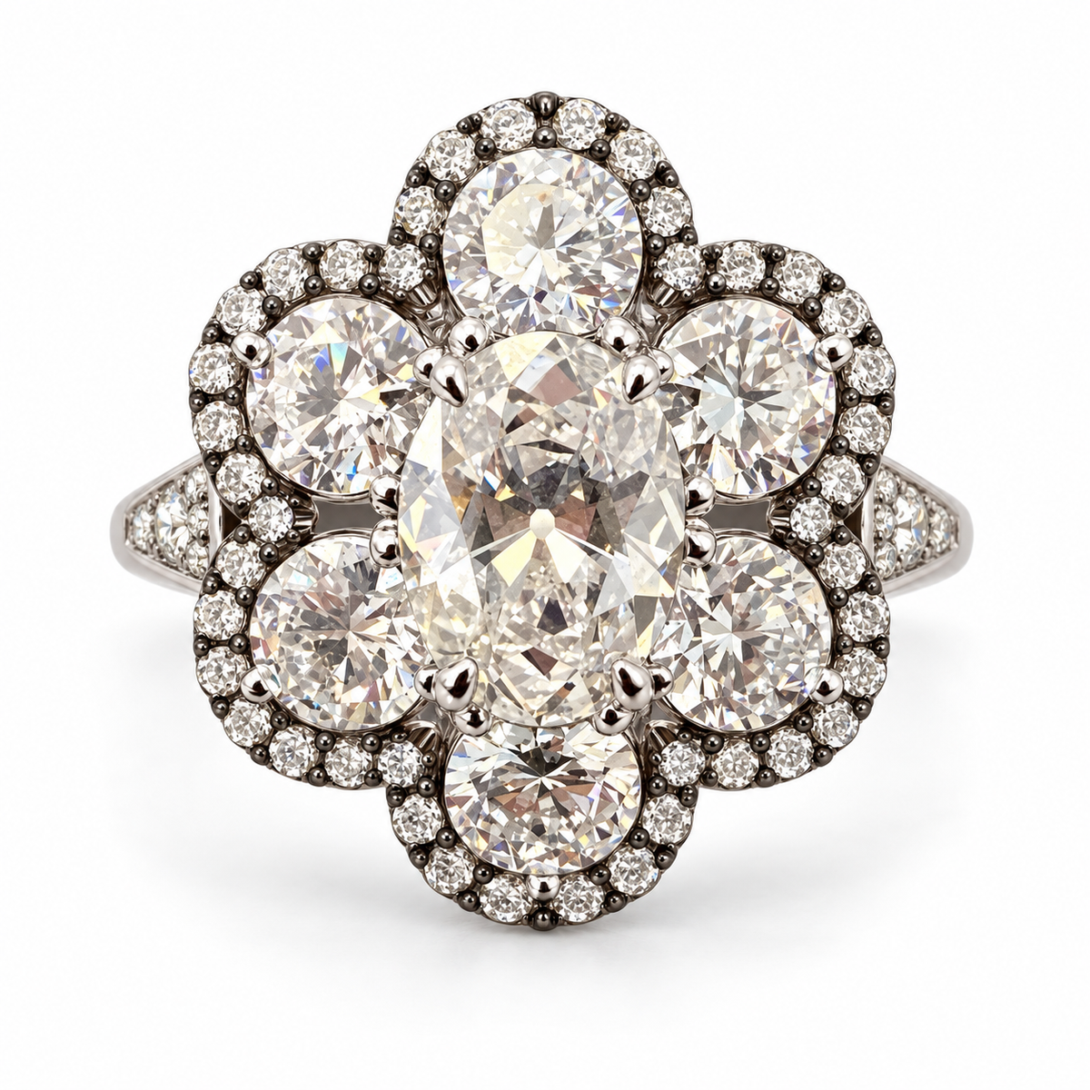 Antique-cut floral lab-grown diamond ring in 18K white gold with six round diamond petals, dark halo details and diamond-set shoulders on white background