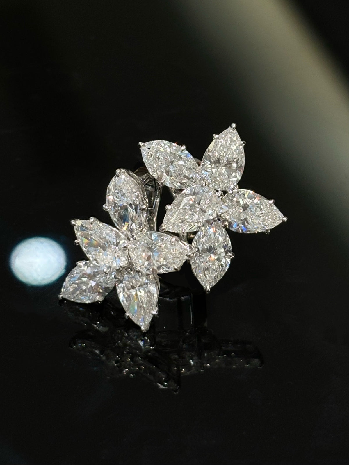 Five-stone floral diamond stud earrings in white metal, original angled pair view1