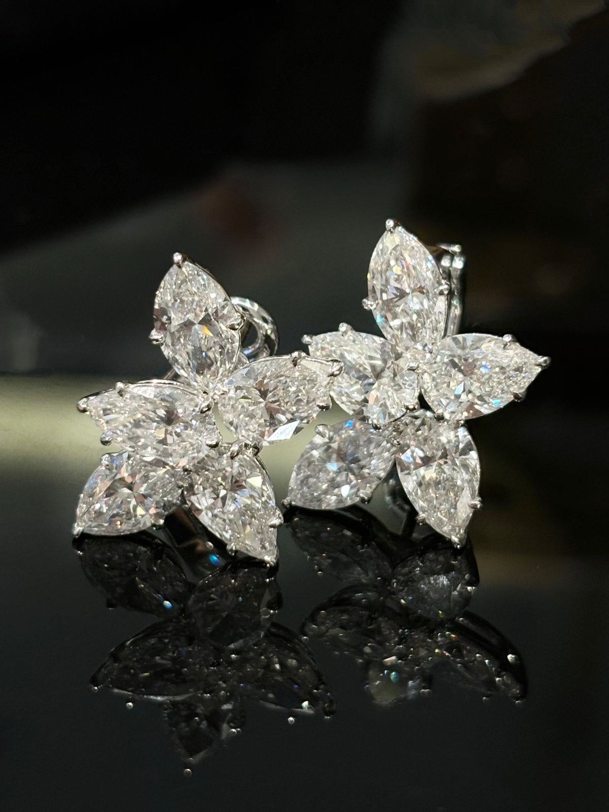 Five-stone floral diamond stud earrings in white metal, original angled pair view2