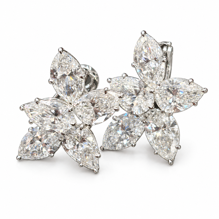 Mixed-cut floral lab-grown diamond stud earrings in 18K white gold, complete five-stone pair on white background