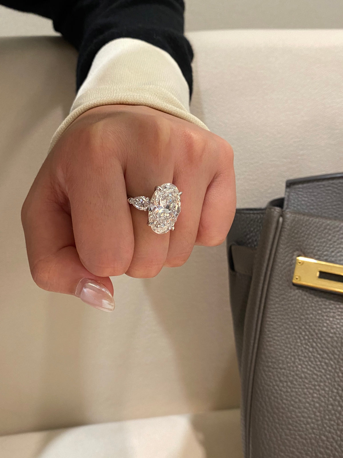 Oval and pear three-stone diamond ring, original wearing view 2