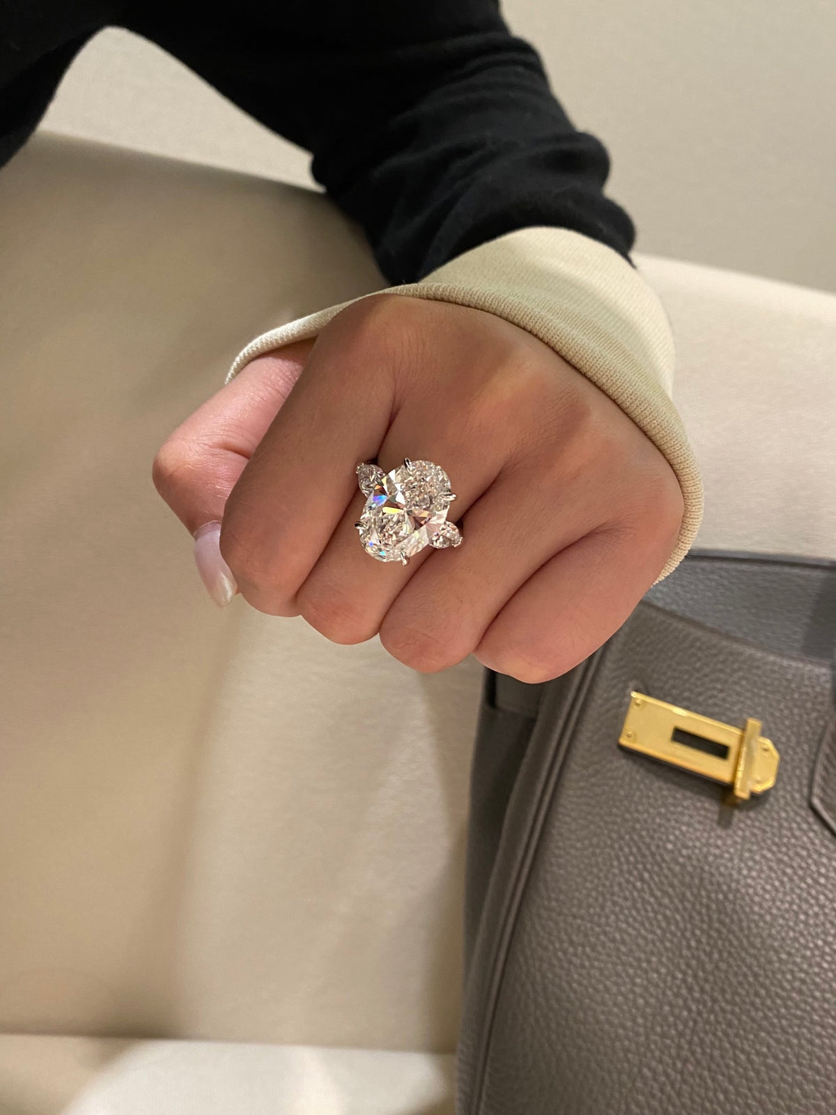 Oval and pear three-stone diamond ring, original wearing view 3