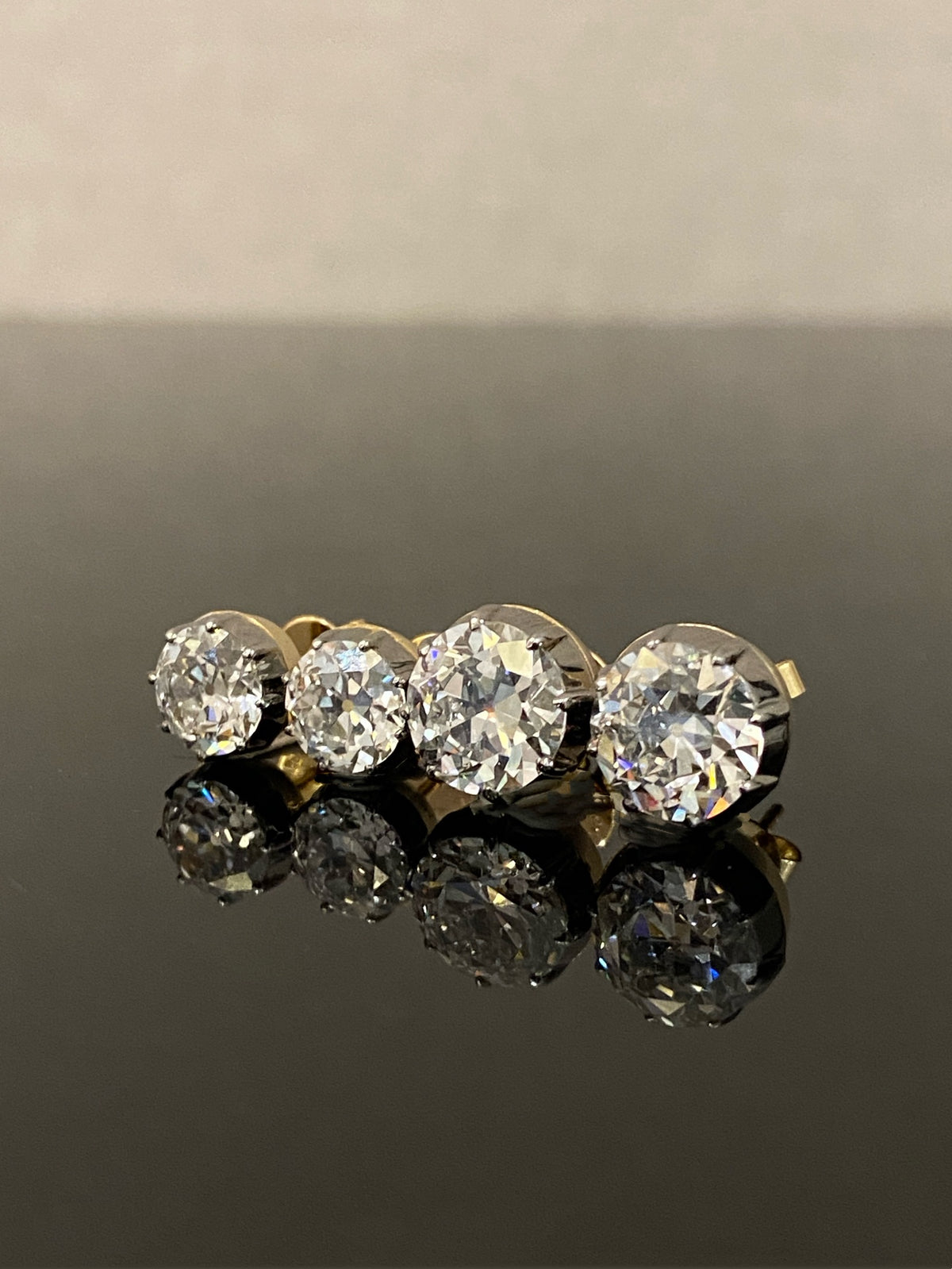 Old European-cut diamond stud earrings, original comparison of two size options; one selected pair supplied