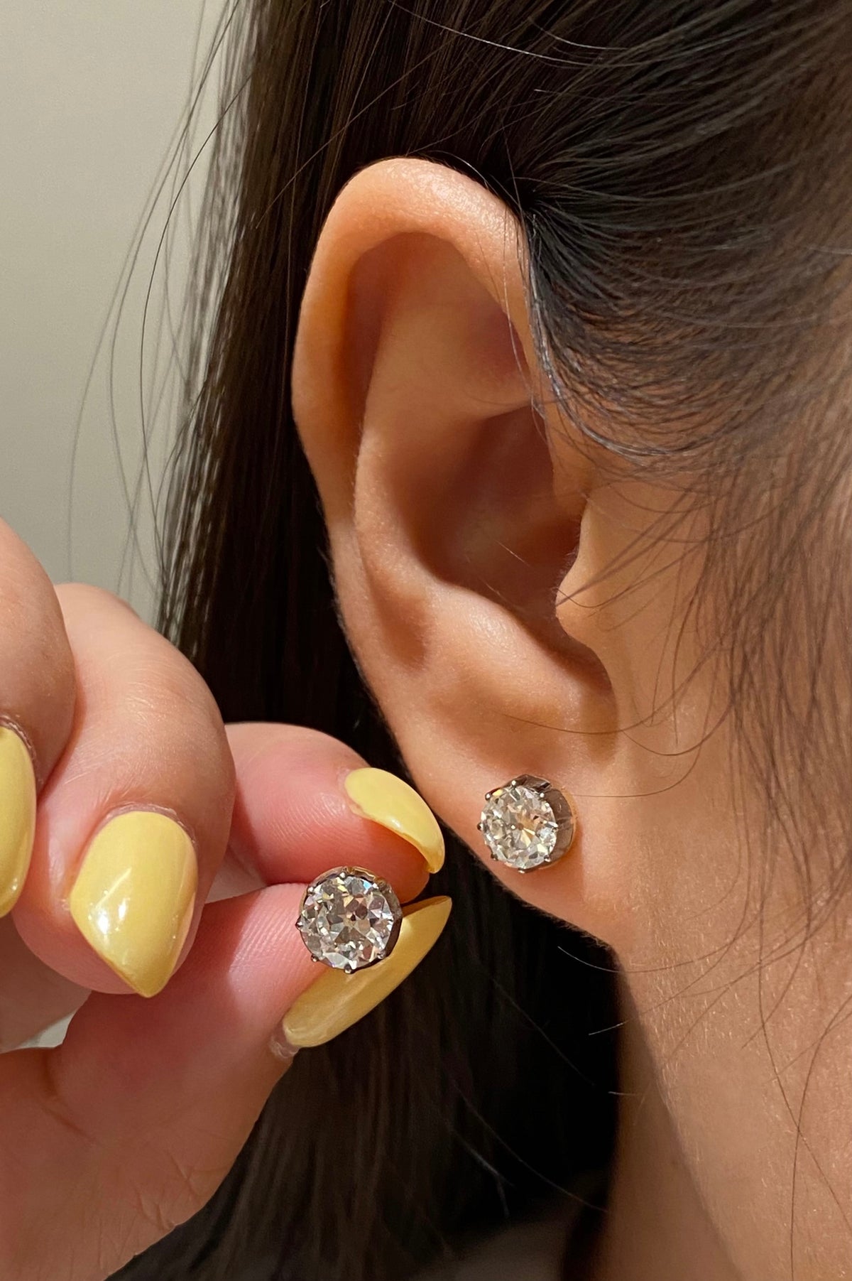 Old European-cut diamond studs, original smaller-pair wearing view