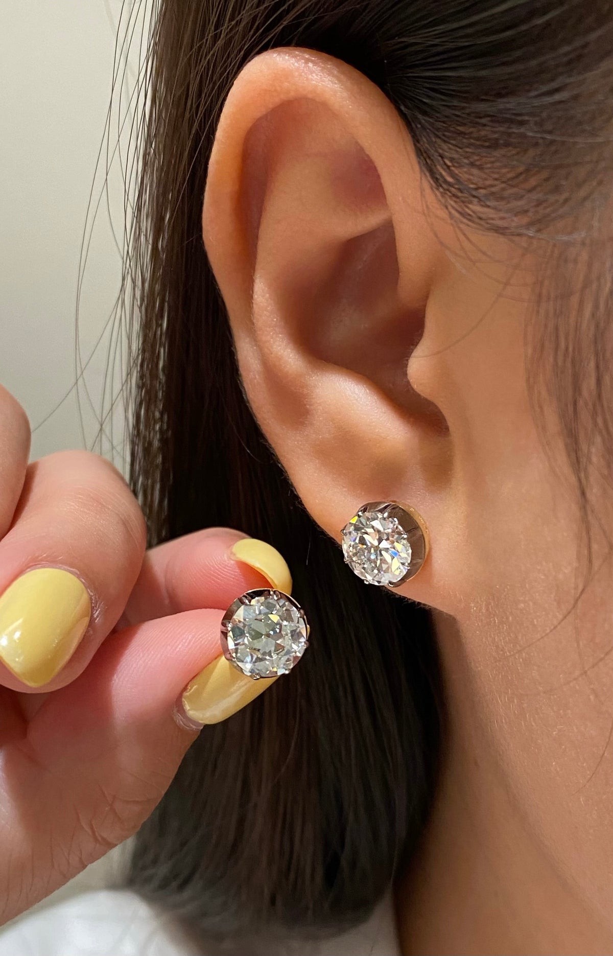 Old European-cut diamond studs, original larger-pair wearing view