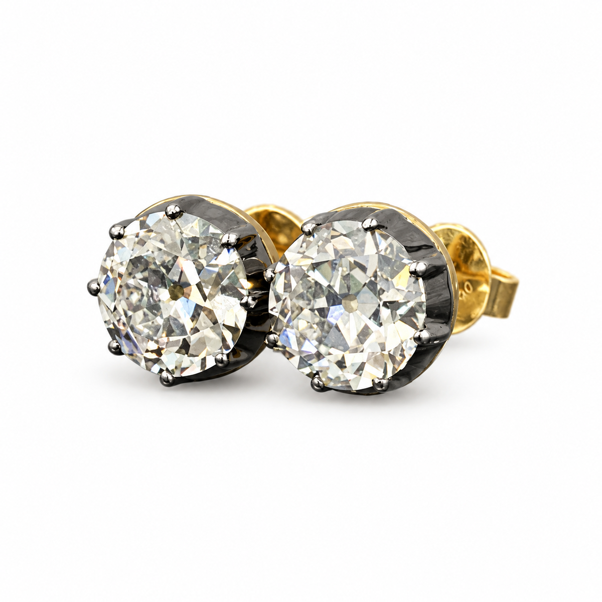 Old European-cut lab-grown diamond stud earrings in 18K yellow gold, 1 ct each pair with dark settings on white background