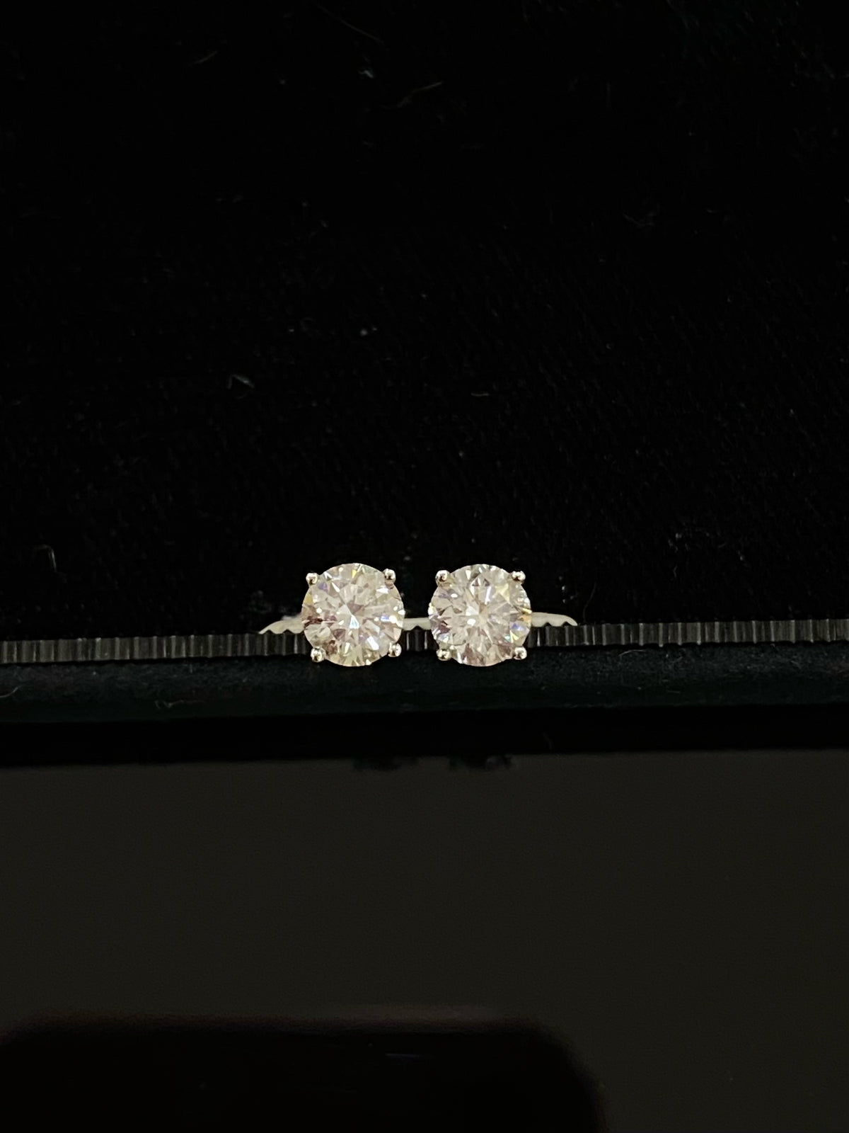 Classic round diamond stud earrings, original frontal pair view in white gold
