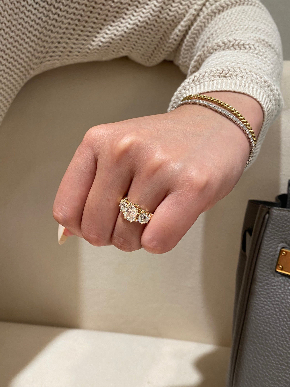 Old Mine-cut three-stone diamond ring, original wearing view 1; bracelets not included