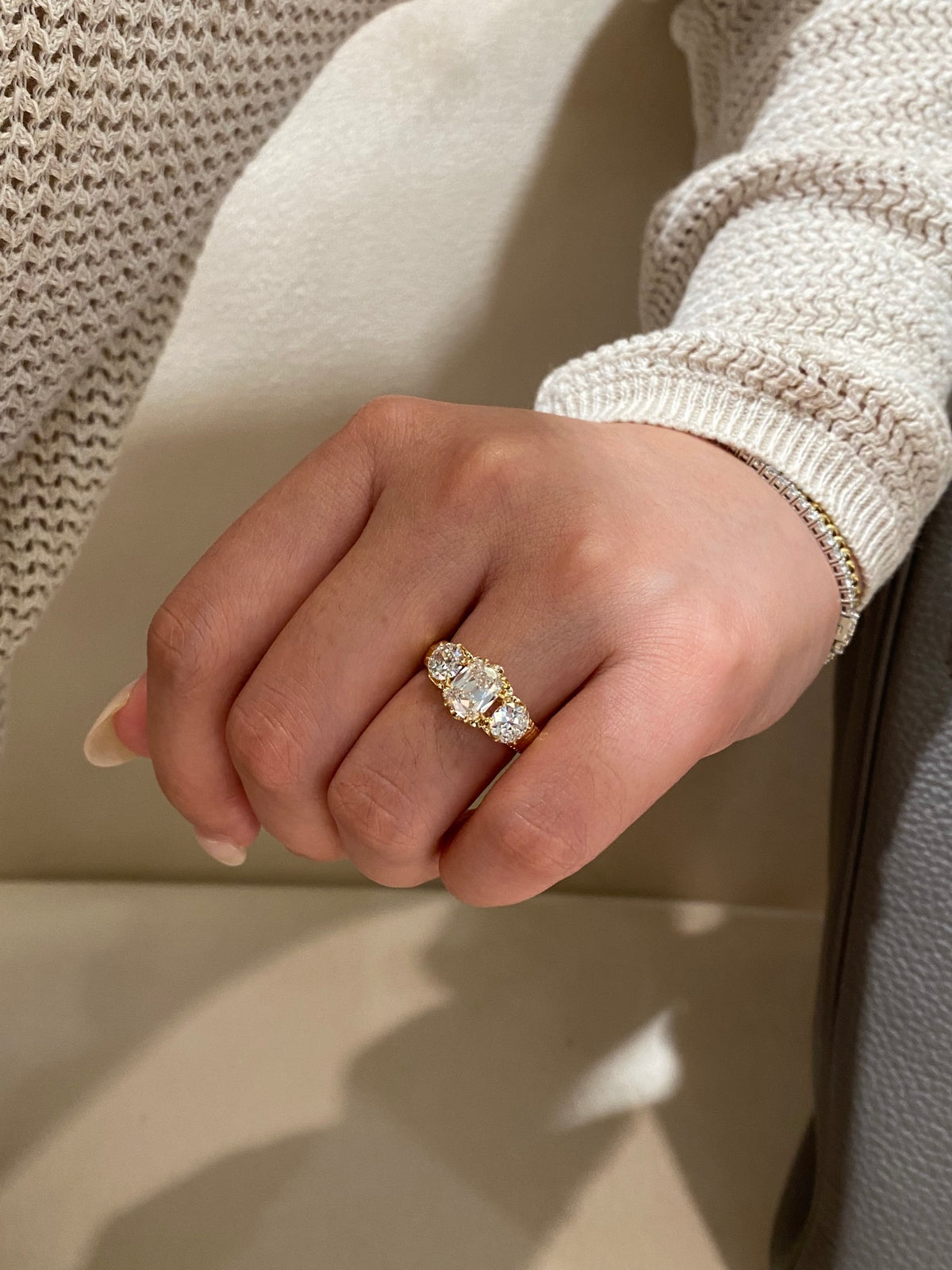 Old Mine-cut three-stone diamond ring, original wearing view 2; bracelets not included
