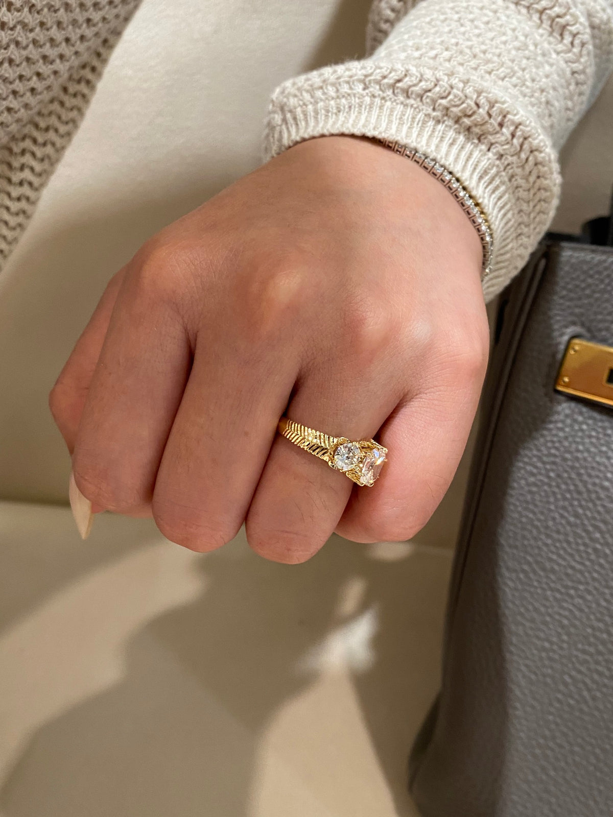 Old Mine-cut three-stone diamond ring, original side wearing view with fluted shoulder