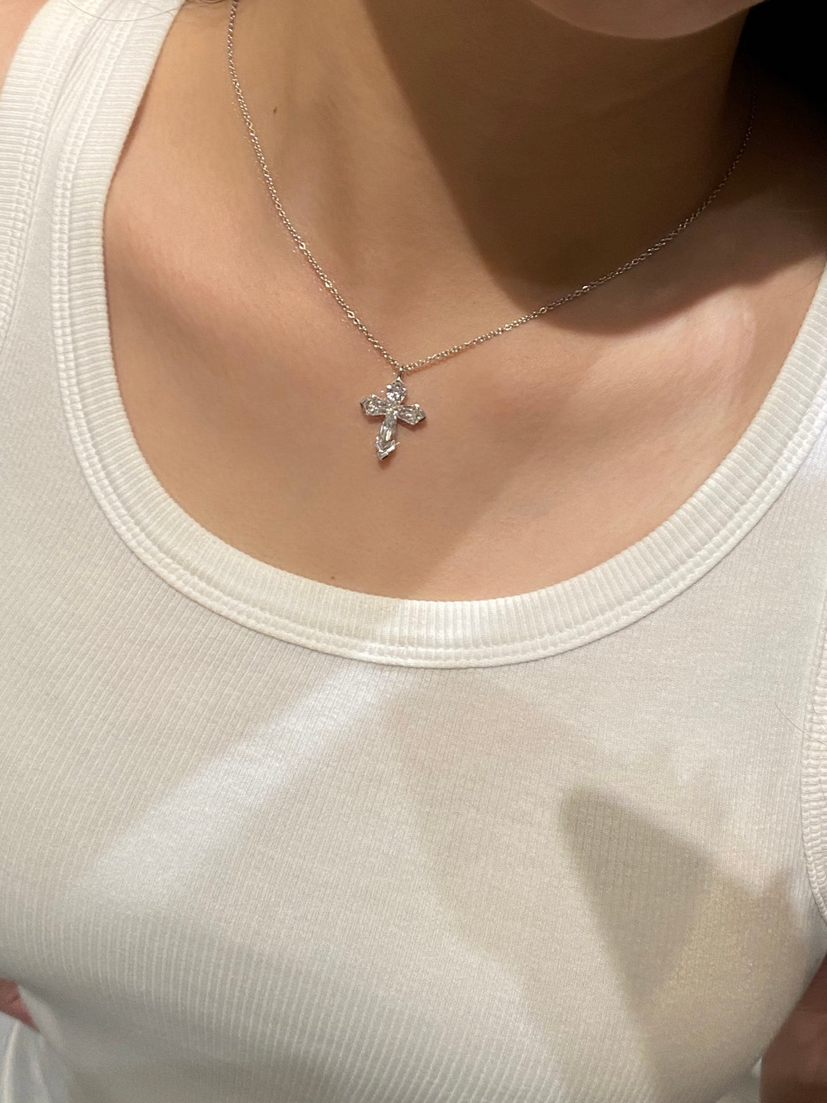 Diamond cross necklace, original angled wearing view
