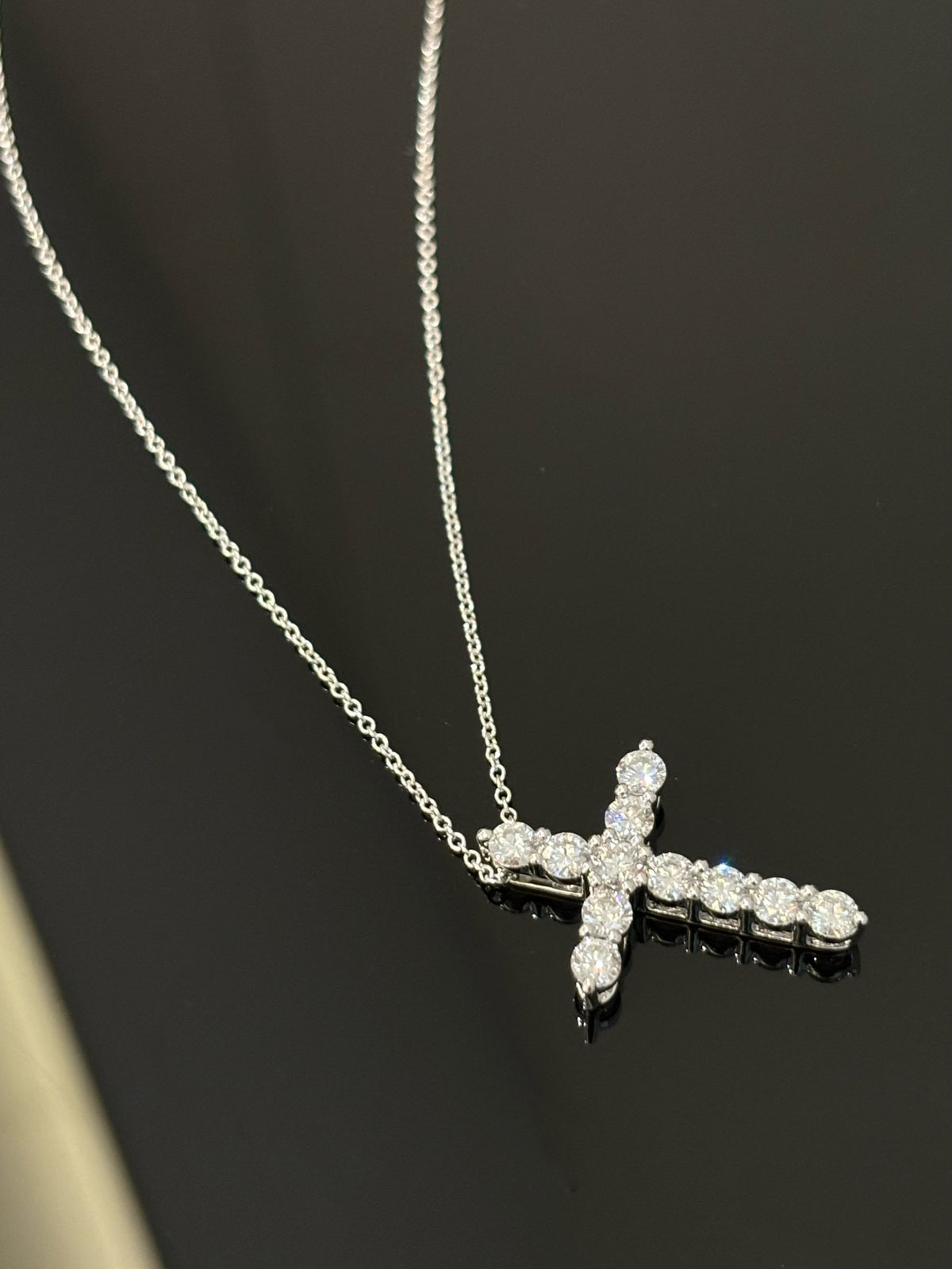 Eleven-round-diamond cross, original angled detail