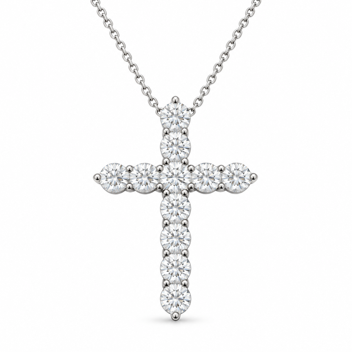 Eleven round lab-grown diamonds form a cross necklace with a fine white-metal chain on white background