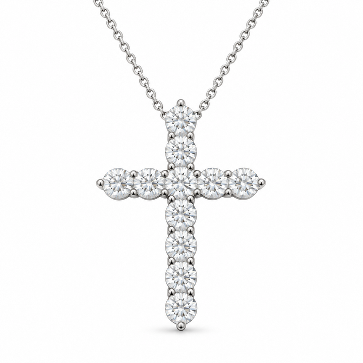 Eleven round lab-grown diamonds form a cross necklace with a fine white-metal chain on white background