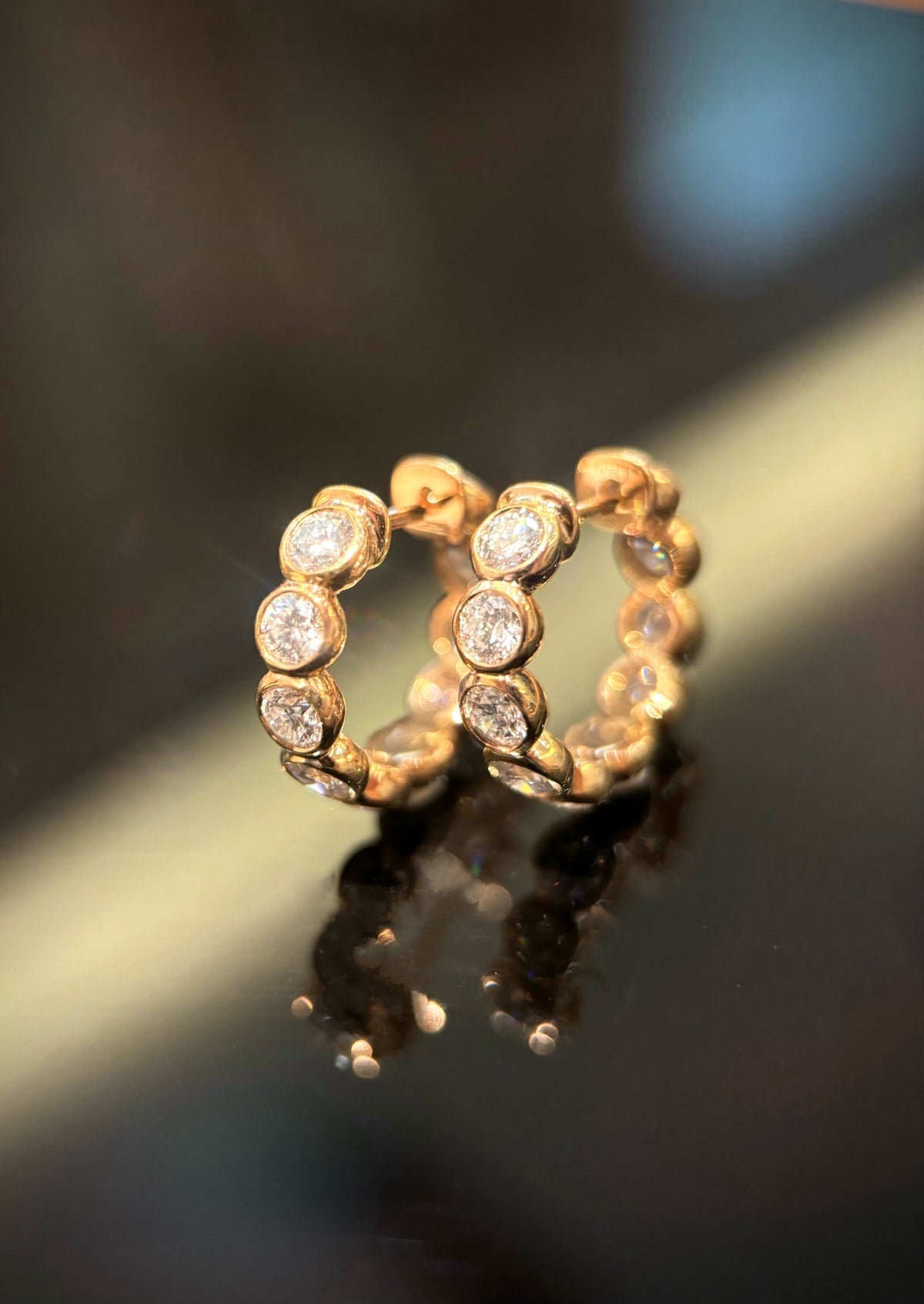 Round bezel-set diamond hoop earrings in yellow gold, original upright pair with butterfly backs
