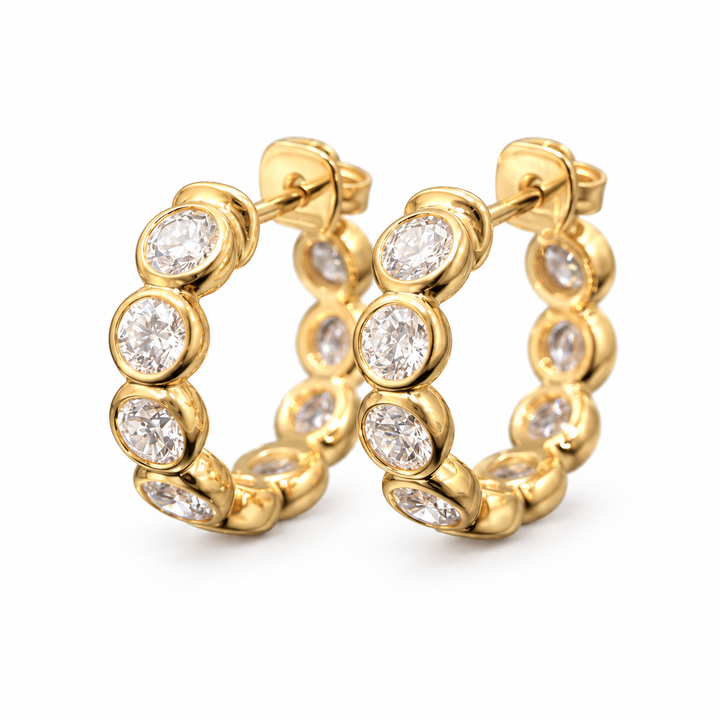 Pair of round bezel-set lab-grown diamond hoop earrings in 18K yellow gold with butterfly backs on white