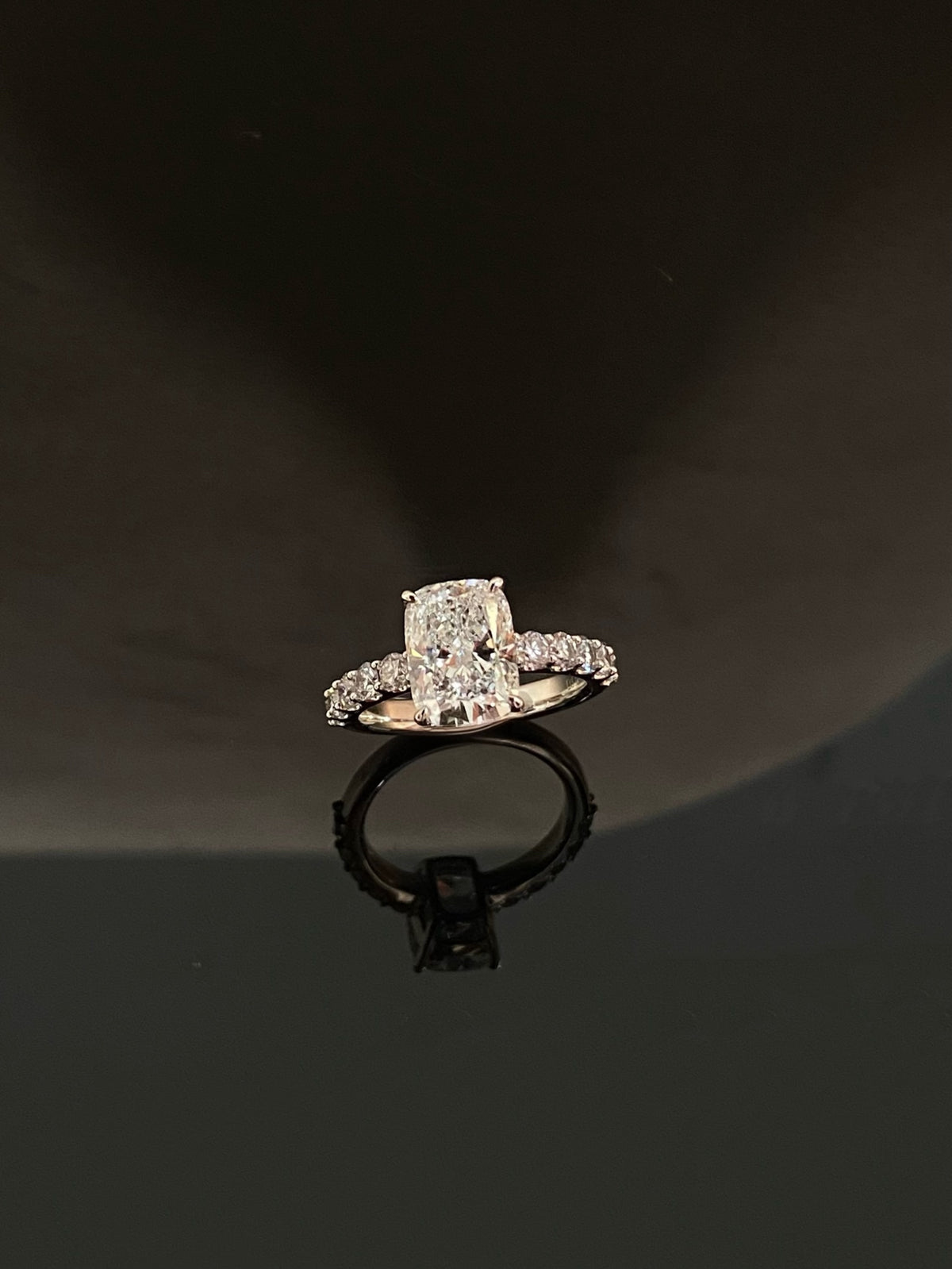 Elongated cushion diamond ring, original white-gold frontal view