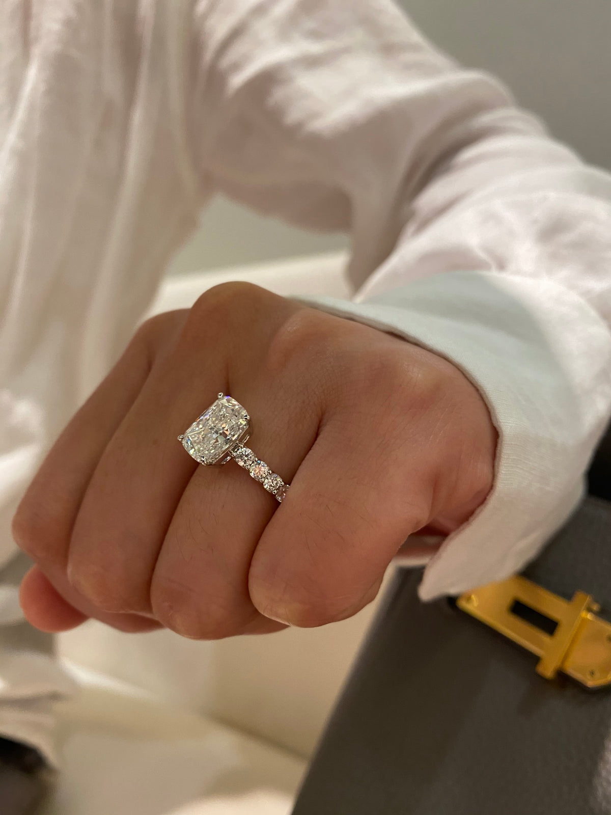 Cushion diamond ring in white gold, original angled wearing view